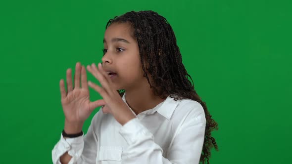 Closeup of Stressed Lost African American Teen Girl Shouting Calling for Help at Chromakey