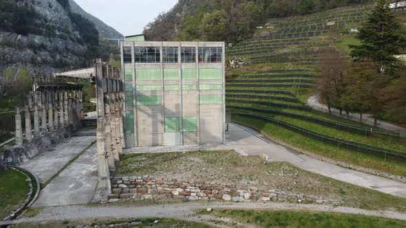 abandoned cement factory monument in the middle of nature drone 4k