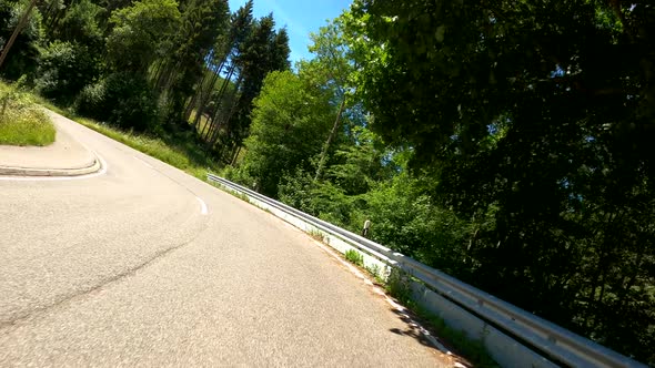 POV Driving on motorcycle on a scenic road in Eifel National Park in Germany