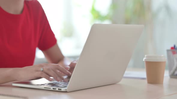 Close Up of Young Blonde Woman Typing on Laptop