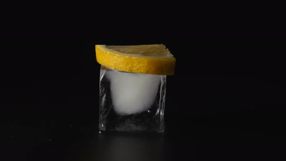 Small Piece of Lemon Lies on an Ice Cube
