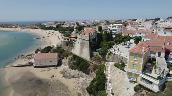 Pullback from São Clemente Fortress on Beautiful coastal village of Vila Nova de Milfontes, Portugal