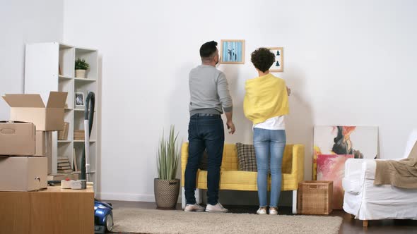 Loving Caucasian Couple Settling Down in New Home