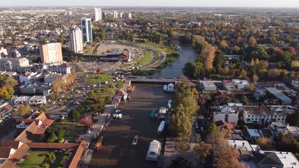 Tigre residential area in Buenos Aires province with cityscape and Parana river and cars crossing br