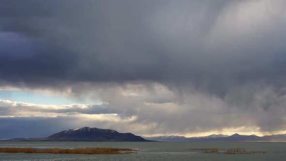 Storm clouds rolling through the sky over Utah Lake