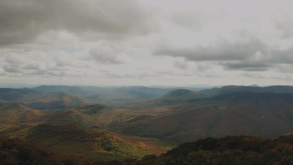 View From Above of Mountain Valley Illuminated By the Rays of the Sun