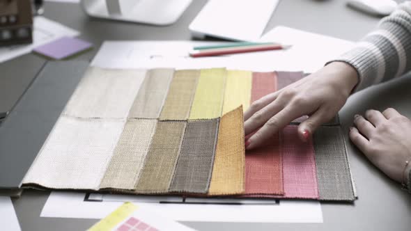 Interior designer checking fabric samples