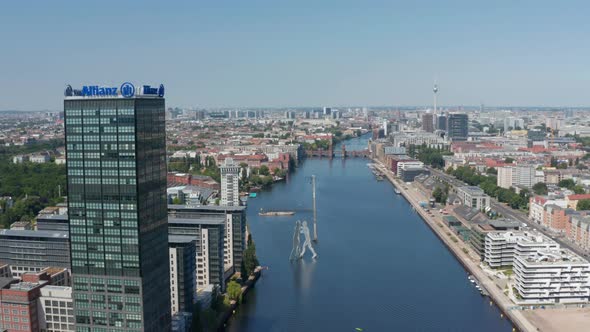 Aerial View of Spree River at Treptower Building Complex and Molecule Man Sculpture on Water