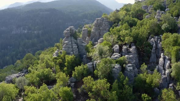 Aerial Panoramic View of Stunning Mountain Slopes with Gray Rocky Columns