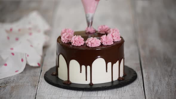 The Pastry Chef Prepares and Decorates the Cake at Home