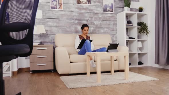 Woman Taking Notes on Clipboard