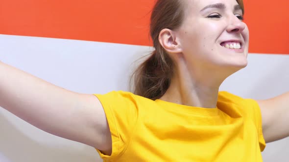 Netherlands Young Woman Celebrates Holding the Flag of Netherlands