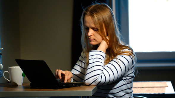 Woman Working With Laptop At Home