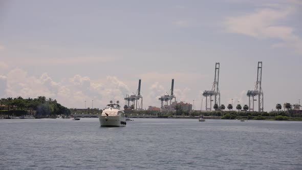 Yacht Anchored In The Bay. 4k Miami Beach Scene With View Of Bridges And Port In Background