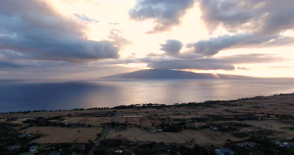 flying over lahaina toward lanai island during ocean sunset