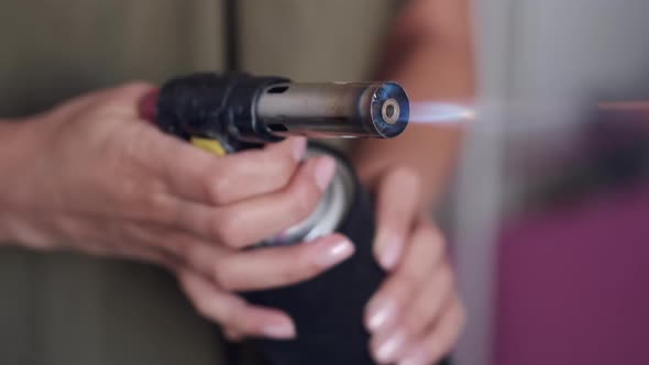 Cropped View of Artist's Hands Holding Paint Spray