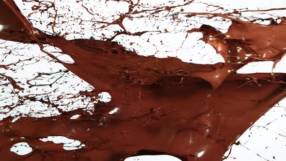 Super Slow Motion Shot of Chocolate Splash on White Background at 1000Fps.