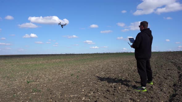 The Pilot Controls a Professional Drone