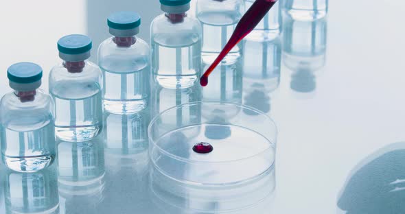 Development of Biological Weapons in the Laboratory a Closeup of a Pipette Dropping a Blood Sample