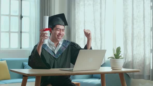 Asian Man Celebrating With University Certificate To The Family During An Online Video Call