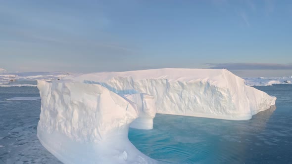 Antarctica Big Iceberg Float Aerial Tracking View