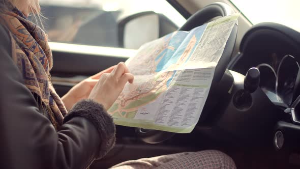 Car Traveling Sitting On Auto Looking Town Plan On Navigation Map For Journey.Tourist Looking On Map