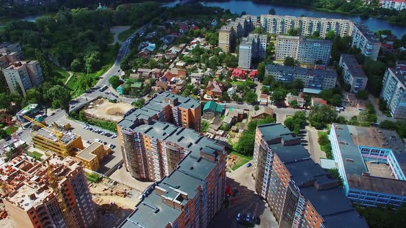 Modern industrial complex in the city. Development of high buildings. Construction site on the citys