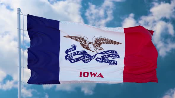 Iowa Flag on a Flagpole Waving in the Wind in the Sky