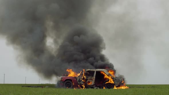 Car On Fire, Burning Car On The Field, Side View