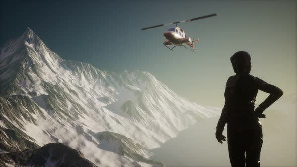 Woman and Helicopter in Winter Mountains