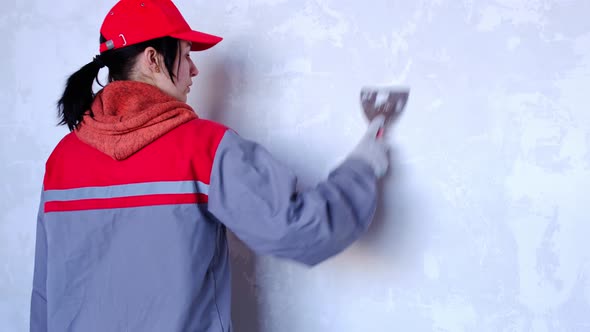 Preparation and cleaning of walls for repair and finishing with a spatula with plaster and putty bef