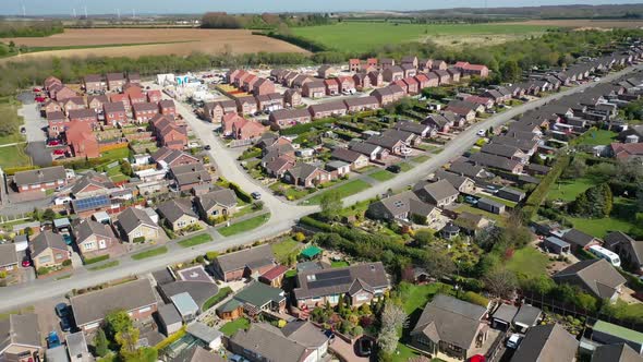 Aerial footage of a typical British residential housing  estate in the Village of Kippax in Leeds UK