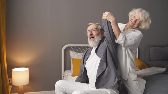 An Elderly Couple Takes Care of Each Other a Wife Massages Her Adult Spouse