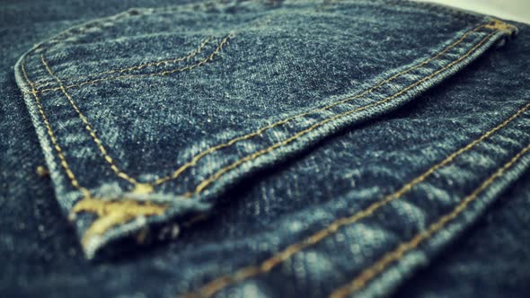 Extreme Detailed of Blue Denim Jeans Texture in Dolly Shot Over Cloth Surface