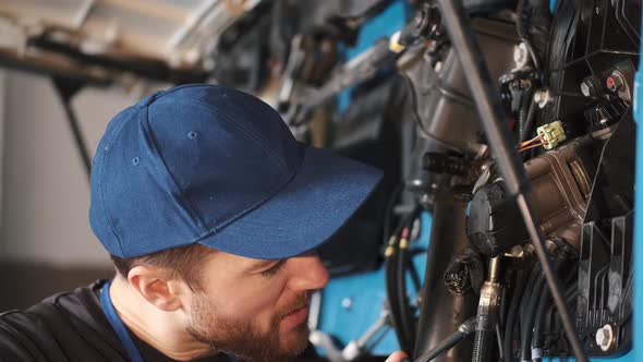 Professional Car Mechanic Check Trucl Engine in Car Garage