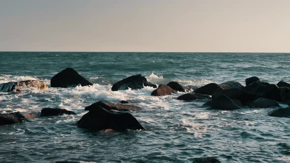 Waves Crash Against the Rock