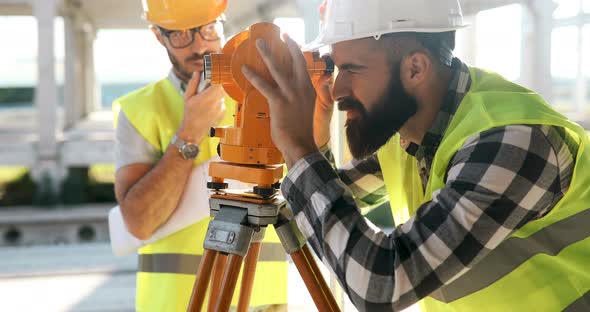 Portrait of Construction Engineers Working on Building Site