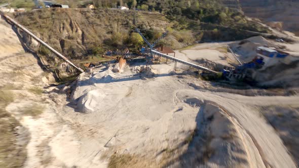 Flying through a steel lattice structure in an abandoned quarry with an FPV drone