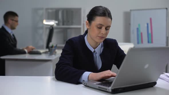 Cute Female Manager Working on Laptop