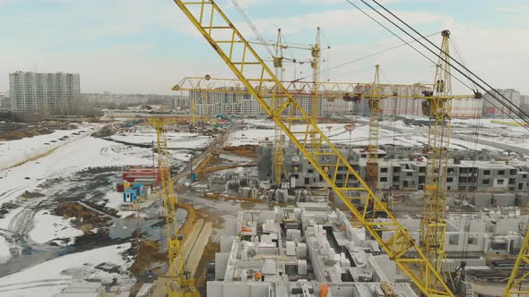 Building of New Complex with Yellow Construction Cranes