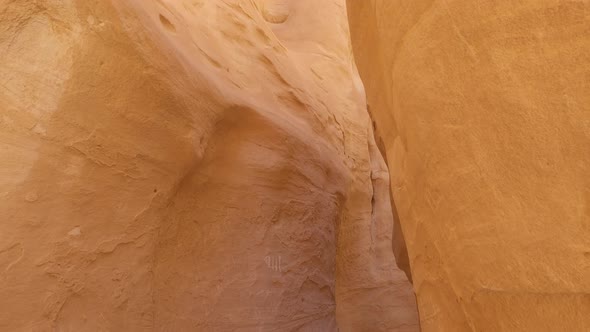 View of a narrow sandy Coloured Canyon in the desert, sandstone cliff close up