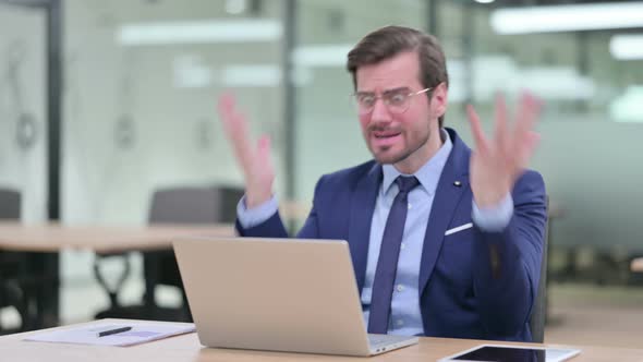 Loss, Young Businessman Reacting To Failure on Laptop 