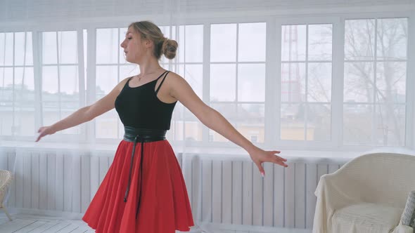 Young Pretty Girl Is Learning Ballroom Dancing in the Studio.