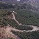 Bird`s eye view on serpentine mountain road. Top view. Asphalt, destination. - VideoHive Item for Sale