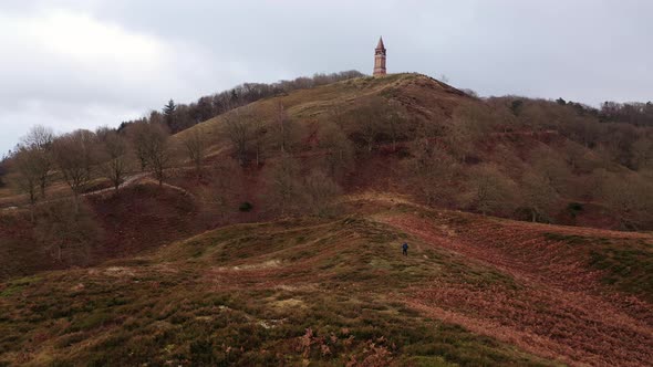 Aerial of a Tourist Hiking Along the Hills in Himmelbjerget Area Denmark