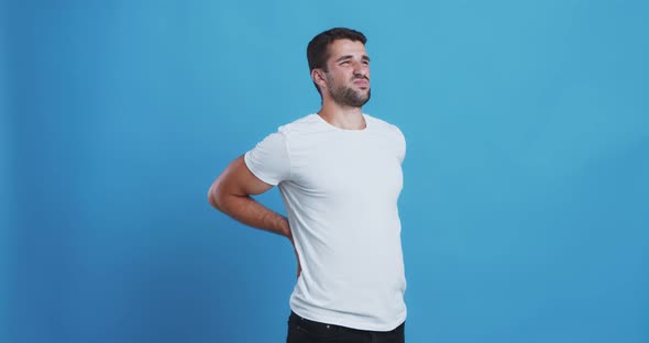 Young Bearded Man Rotating Hips, Exercising at Home Interior