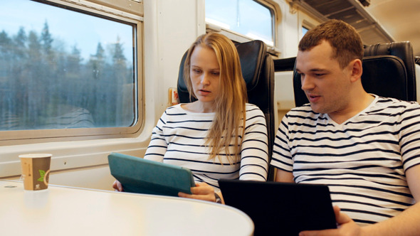 Young People Talking In The Train Looking