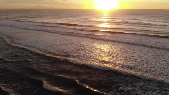 Ocean waves at sunset