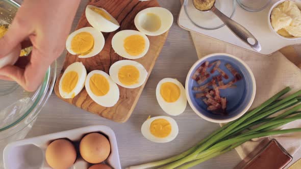 Preparing deviled eggs with organic eggs for appetizer. Step by step recipe.