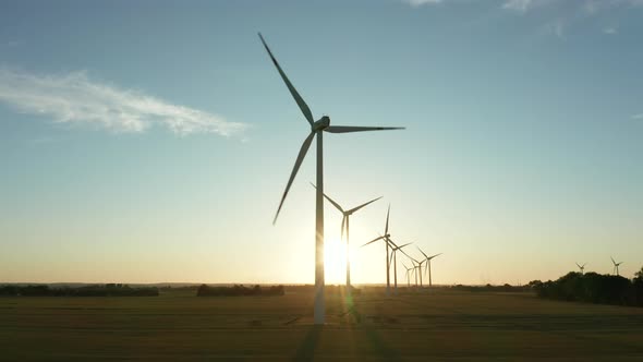 Wind Turbines in a Field on a Beautiful Sunset Aerial View